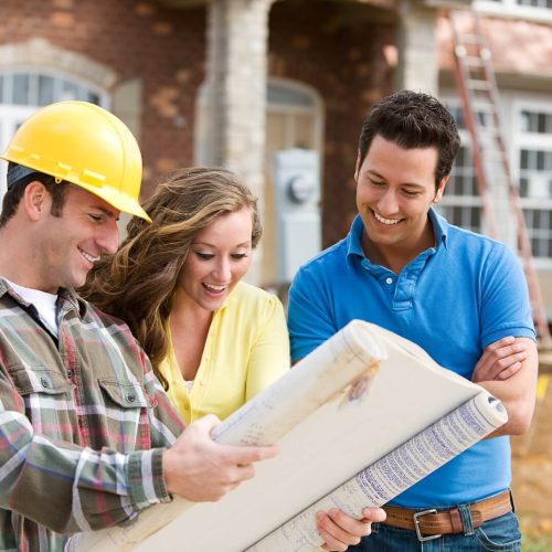 building contractor holding map